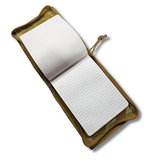 Close-up of a camouflage Notebook cover.